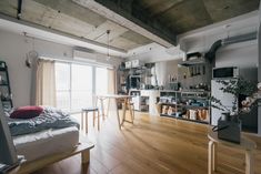 a living room filled with furniture and wooden floors