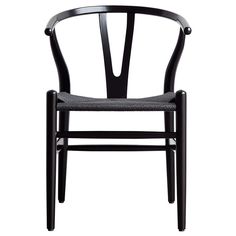 a black and white chair with a beige seat