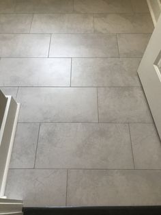 a bathroom floor that has been cleaned and is white