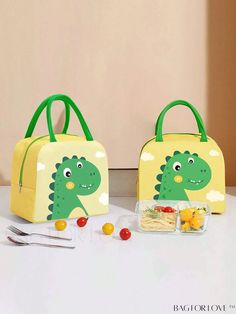 two children's lunch bags sitting on top of a table