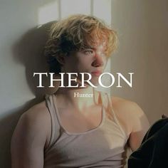 there is a woman standing next to a wall with the word thoron on it