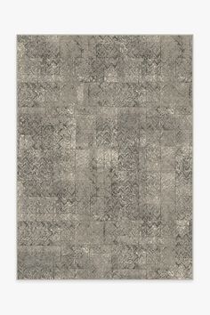 a gray rug with an abstract design on it