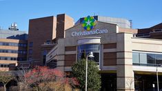 a large building with a sign that says christiana care on the front and side