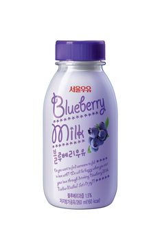 a bottle of blueberry milk on a white background