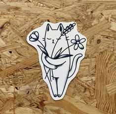 a sticker with an image of a cat holding flowers on it's back