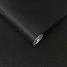 a close up view of a black wallpaper with an oval hole in the middle