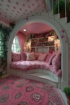 a living room with pink and white decor on the walls, rugs and windows