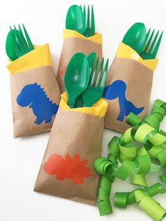 three bags with plastic forks and spoons in them