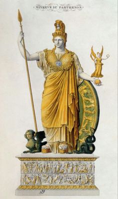 the statue is holding a staff and wearing a gold dress with an elaborate headdress