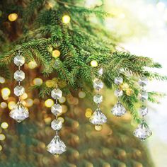 a close up of a christmas tree with lights in the background