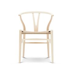 a wooden chair on a white background with no one in the room to see it