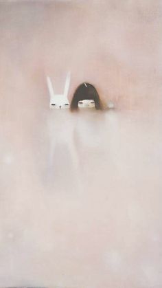 two white rabbits are hiding in the fog