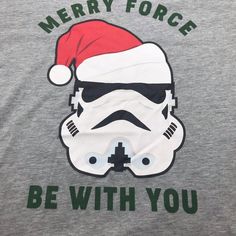 a star wars shirt with a storm trooper wearing a santa hat