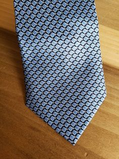 This is a vintage, Nautica, silk, necktie. It is a very nice blue pattern. This tie measures 59.75 inches in length x 4 inches at the widest part. Don't forget to stop in at my other Etsy shop... http://www.etsy.com/shop/xtdesigns. Follow me on Twitter at... MyYiayiaHadThat@MyYiayiaHadThat. If you have a wish list or are looking for something specific, please ask. I may have exactly what you are looking for. As always please convo me with any questions or concerns regarding this item or with any Blue Tie With Pocket Square For Business, Blue Standard Tie For Formal Suit, Blue Ties With Pocket Square For Business, Blue Formal Suit And Tie Accessories, Blue Semi-formal Necktie, Blue Semi-formal Standard Tie, Classic Blue Neckwear For Semi-formal Occasions, Light Blue Accessories For Black Tie Event, Blue Semi-formal Neckwear