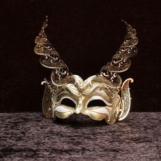 All models are made in Italy and distributed in the United States,  Our masks are manufactured according to the oldest Venetian techniques and with the most innovative materials in the sector. Each mask is a unique work of craftsmanship that comes right into your home, created and personalized just for you. With this mask you will impress everyone at any dance or costume party. 🎭 🎃 The mask is unisex and is one size fits all. 👩🏽 👨🏼 It is made with hypoallergenic and certified materials. ✅ Masquerade Men, Paper Mache Mask, Venice Mask, Devil Mask, Half Mask, Costume Masks, Venetian Mask, Decoration Originale, Swarovski Stones