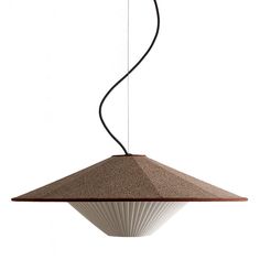 a brown and white lamp hanging from a ceiling fixture with a black cord attached to it