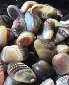 some very pretty colorful rocks together on the ground with words below it that read, zen with gems