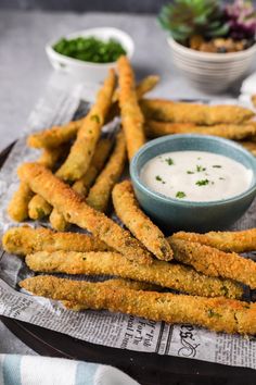 fried fish sticks with dipping sauce on the side