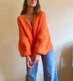 Orange solid cardigan for women. This orange sweater, has a gorgeous open front and is 100% handmade.This crochet cardigan is made with hight quality yarn, anti allergic and super super soft. This amazing oversize fall cardigan is the garment that you would want wear it forever! Perfect to wear it with dresses or with a jean! Super comfortable, stylish and versatile! WHICH IS MY SIZE? In order to know which is the perfect size for you, you just have to measure your chest. Below, you can find the measurements referred to every size: Measurements referring to the chest contour:  Size: waist: 104 cm/ 41 in. Length: 53 cm/ 20.5 in. If you can't find your size or you are not sure about the size, contact me and I will make the one that fits your measurements. HOW TO KEEP YOUR CARDIGAN PERFECT: I Orange Crochet Cardigan, Orange Long Sleeve Knit Sweater, Orange Bohemian Long Sleeve Cardigan, Bohemian Long Sleeve Orange Cardigan, Orange Long Sleeve Bohemian Cardigan, Long Sleeve Orange Bohemian Cardigan, Casual Orange Hand Knitted Sweater, Oversized Orange Cardigan, Orange Hand Knitted Sweater For Fall