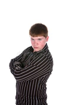 a young man with his arms crossed and looking at the camera royalty images, clippings