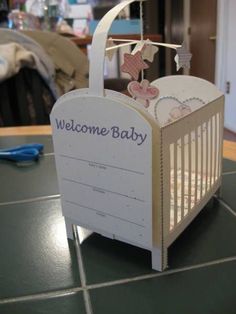 a welcome baby sign on top of a table