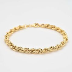 Make a statement with our Rope Chain Bracelet! Featuring a unique rope chain design and a 100mm hollow chain, this 7.25 inch bracelet is made in sterling silver and gold plated for a luxurious touch. Perfect for stacking, this bracelet is a must-have for any jewelry collection. Elegant 14k Gold Rope Chain Bracelet, Gold Rope Chain Bracelet, Rope Chain Link Bracelet Gift, Rope Chain Link Bracelet As Gift, Classic Gold Bracelets With Rope Chain, Elegant Gold Bracelet With Rope Chain, Elegant Bracelets With Rope Chain And Link Shape, Elegant Bracelets With Link Rope Chain, Elegant Bracelets With Rope Chain Link