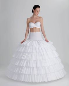 Lightweight crinoline and hoops petticoat with tailed layers for an aline wedding dress. Made with bones. The petticoat comes in ivory color. Waistline closing - Elastic Band Skirt diameter at the bottom: 460 cm The petticoat structure: J-619C Pettıcoat, 6 Hoops, 6 Ruffles, 460 cm With its layered ruffles, it ensures that the wires are not visible on the dress. It hugs your waist thanks to the elastic band used on the waist. We guarantee that you can move comfortably in it on your special day. B Crinoline Wedding Dress, Wedding Ball Gown Dresses, Hoop Petticoat, Puffy Wedding Dresses, Wedding Ball Gown, Ball Gown Dress, Puffy Dresses, Aline Wedding Dress, Bridal Ball Gown