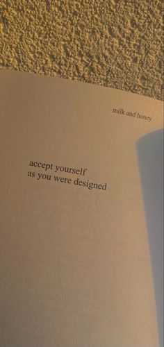 an open book with the words accept yourself as you were designed