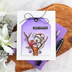 a handmade christmas card featuring a koala bear