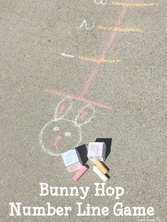 the bunny hop number line game is written in chalk and crayon pencils