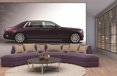 a living room with a purple couch and a large car on the wall behind it