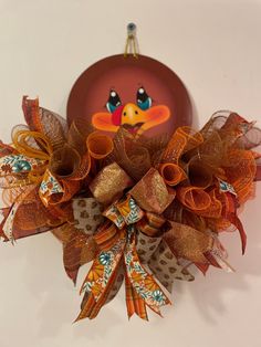 a close up of a bird decoration on a wall