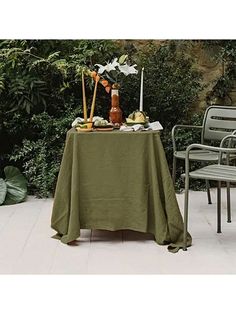 the table is covered with an olive green cloth