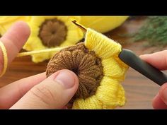 someone is crocheting a flower with yarn