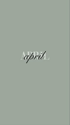 the word april written in black ink on a gray background