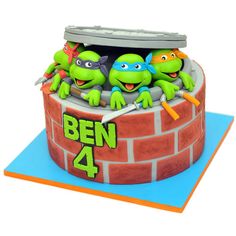 a cake made to look like the teenage mutant ninjas are coming out of a brick wall