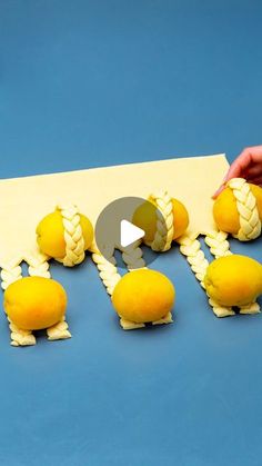 someone is cutting out the letters made from fake lemons