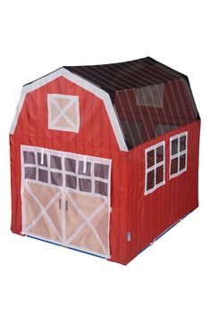 a red barn shaped tent with windows and doors