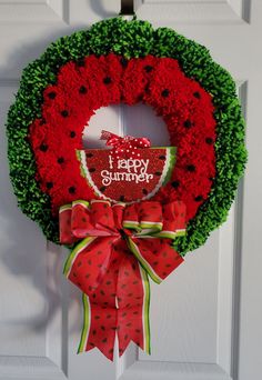 a red and green wreath with the words happy summer on it