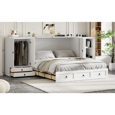 a white bed sitting next to a dresser with drawers on it's bottom shelf