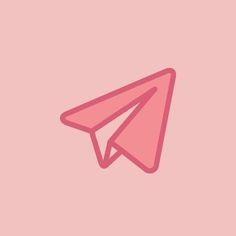 a pink paper airplane on a pink background