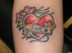 a tattoo with a heart and flowers on it