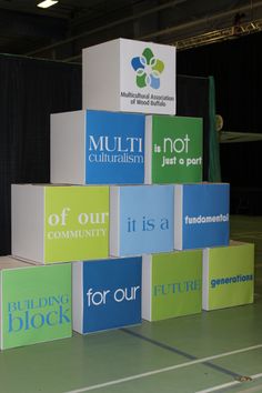 several colorful blocks stacked on top of each other in front of a black backdrop with the words multi - n - not community