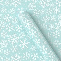 a light blue background with white snowflakes