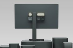 an image of a computer monitor with speakers on it's sides and the screen showing two different buttons