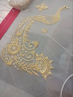 the table is covered in gold thread and beads