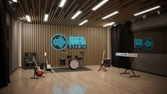 an acoustic studio with sound equipment and lights on the walls, along with wooden flooring