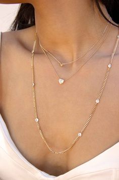 Materials18k Gold Plated, Brass, Cubic Zirconia Length 14.25" - 15.5" with a 5" extender chain Closure Clasp Dainty Cubic Zirconia Chain Necklace, Ettika Jewelry, Crystal Heart Necklace, Pearl Cuff, Back Necklace, Layered Necklace Set, Dainty Chain, Chain Anklet, Layered Necklace