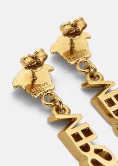 An elegant accessory, these drop earrings feature small La Medusa studs and long, Versace logo letter pendants. All Versace jewelry  products are lead and nickel free. All materials are hypoallergenic. Versace Gold, Versace Jewelry, Versace Logo, Logo Letter, Pin Logo, Letter Pendants, Earring Sale, Elegant Accessories, Saks Fifth