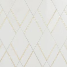 a white and gold tiled wall with lines